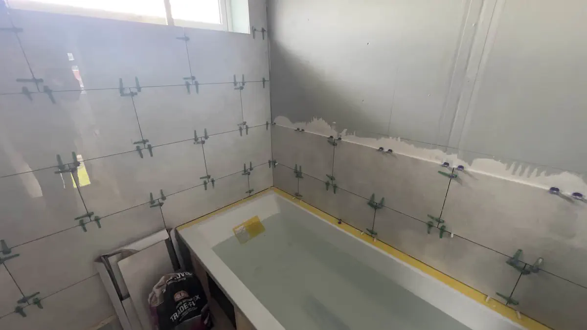 Bath installation and start of tiling