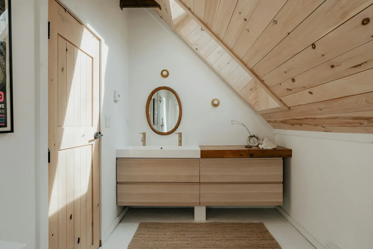 Loft en-suite bathroom with modern fittings and sloped ceiling